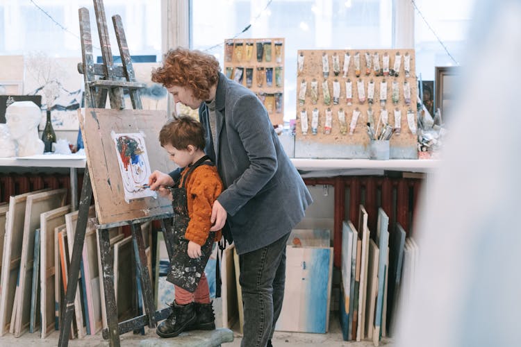 A Boy Learning How To Paint