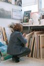Woman in Gray Long Sleeve Shirt Sitting on Chair