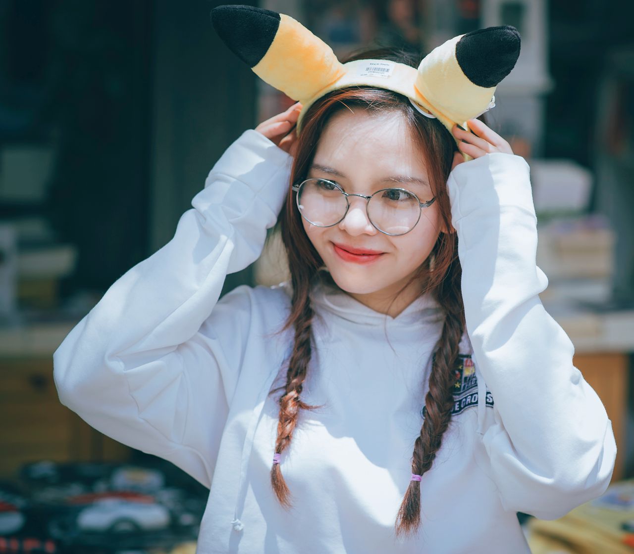 young woman having fun in daylight wearing a cute costume with pikachu