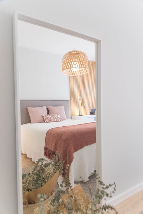 Free Floor Mirror with the Reflection of Bedroom Stock Photo