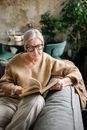 Woman in Brown Knit Sweater Wearing Eyeglasses