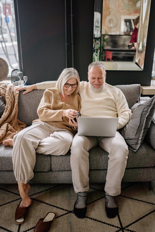 Free Elderly Couple Sitting on the Sofa Stock Photo