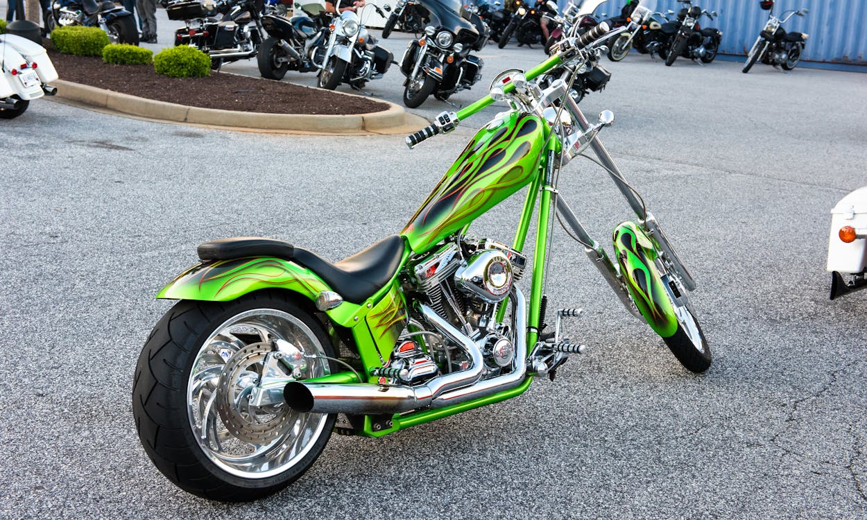 Free Green Naked Chopper Motorcycle on Parking Lot Stock Photo