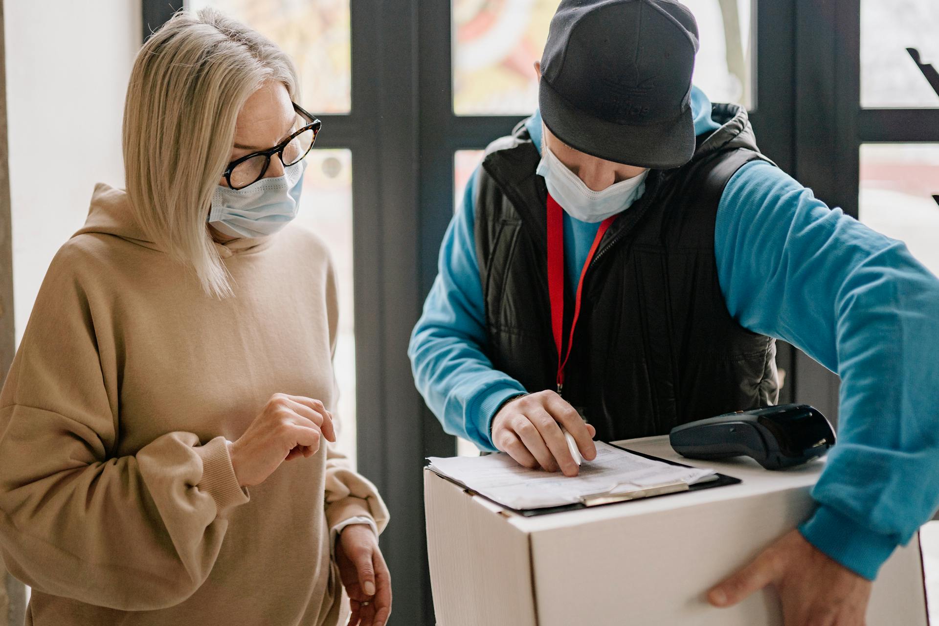 Man and Woman Looking at a Document