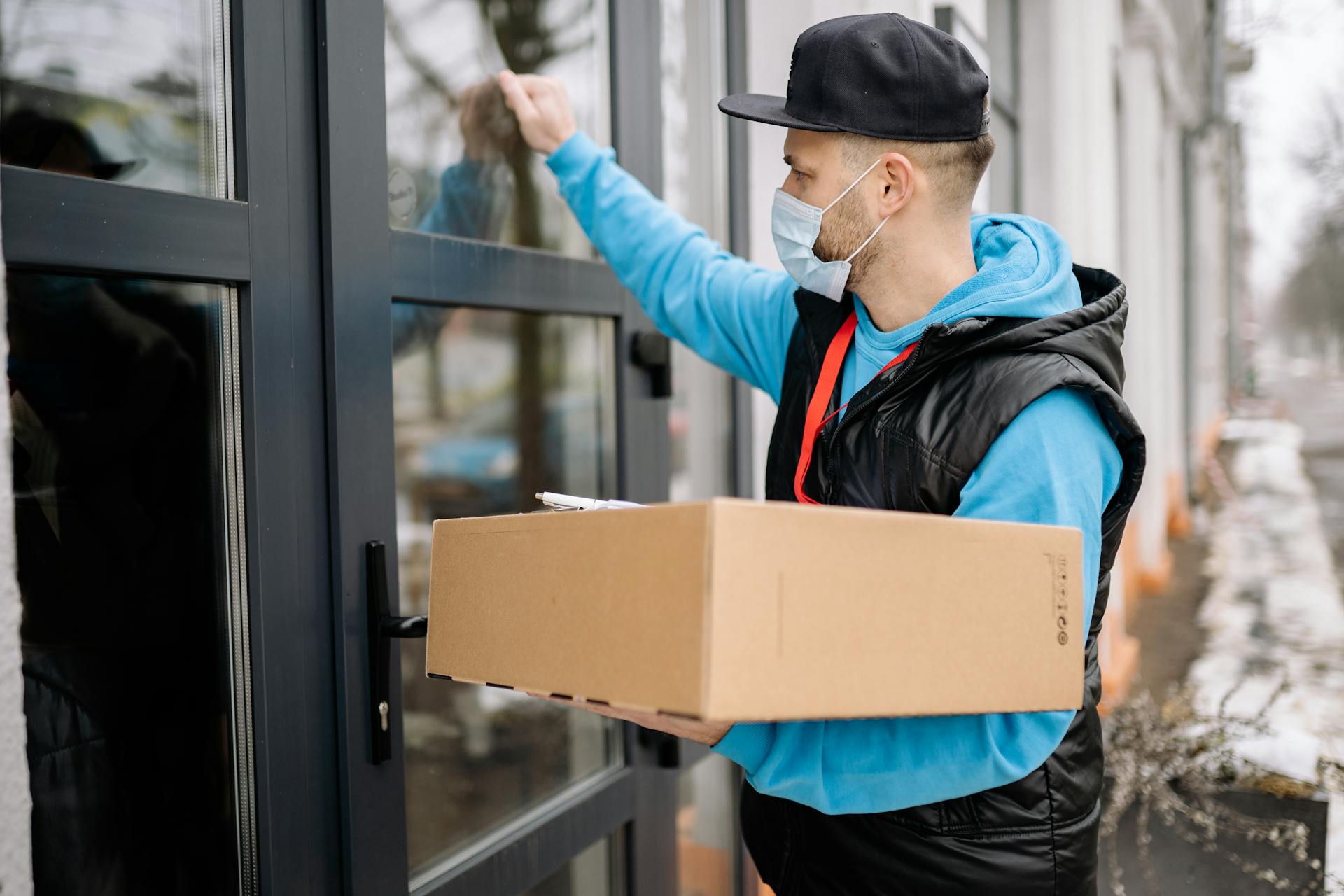 Delivery Man Knocking on a Door