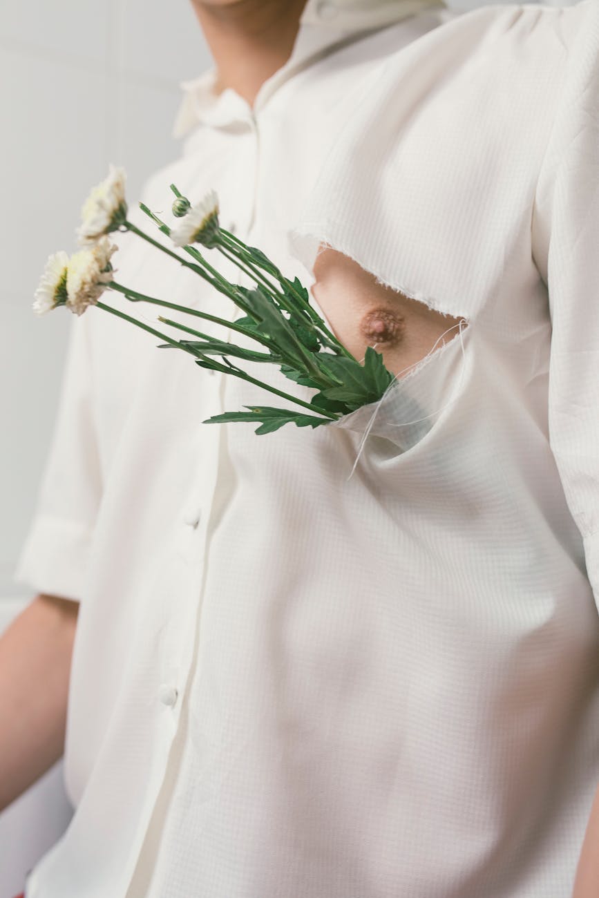 man in white button up shirt with white flowers