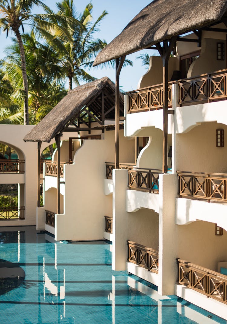 Rooms With Balconies By The Poolside Of A Beach Resort