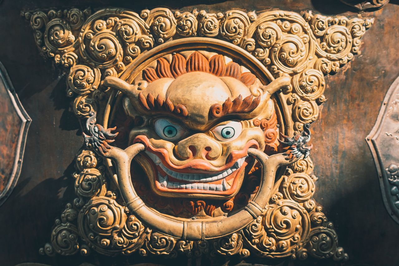 close up of a vibrant and detailed traditional asian sculptural artwor