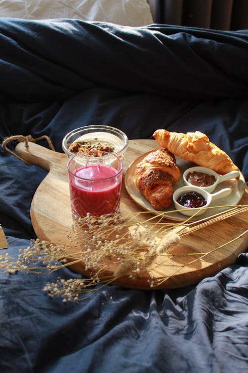 Free Smoothie and Croissants on Wooden Board Stock Photo