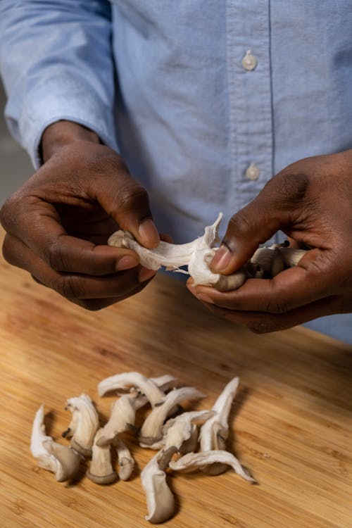 Person Prepares Mushrooms 