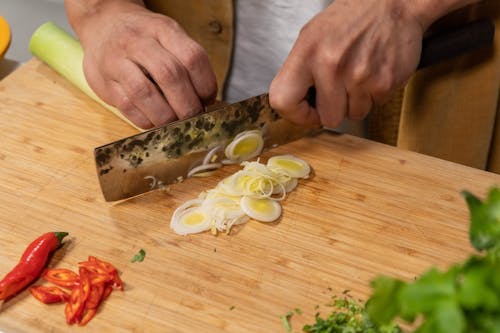 Close Up Shot of a Person Slicing Onions