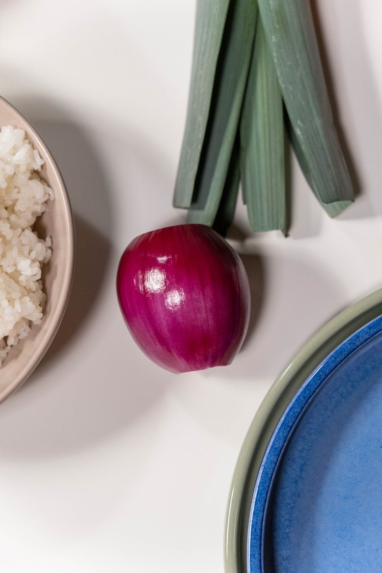 Peeled Whole Red Onion On White Surface 