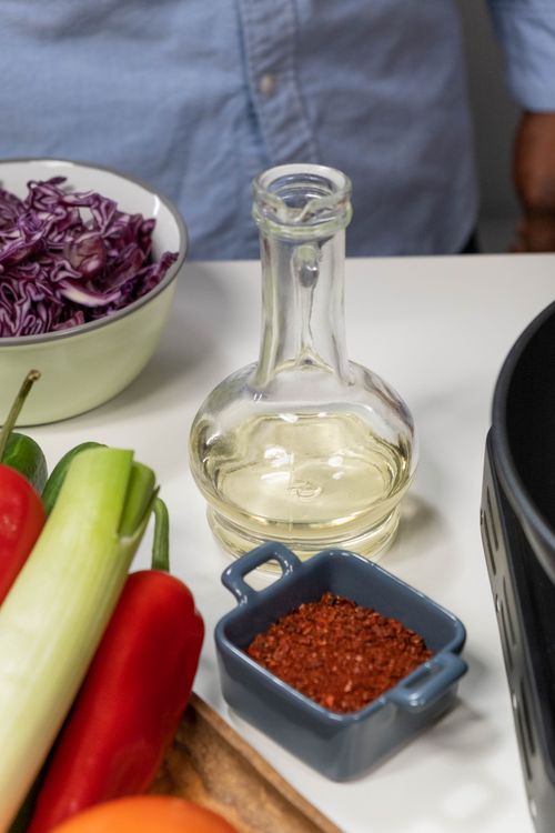 Free Close-up of fresh vegetables and spices ready for cooking, featuring vibrant colors. Stock Photo