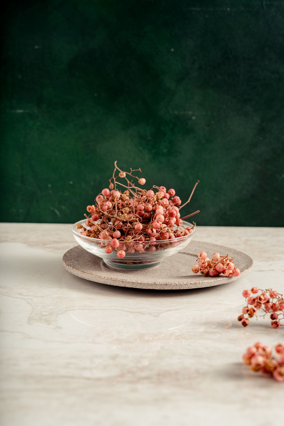 Pink peppercorns in a glass bowl