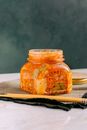Clear Glass Jar with Kimchi beside the Wooden Chopsticks