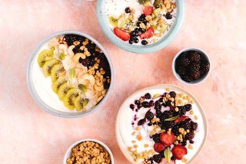 Sliced Kiwi and Blackberries on Ceramic Bowls