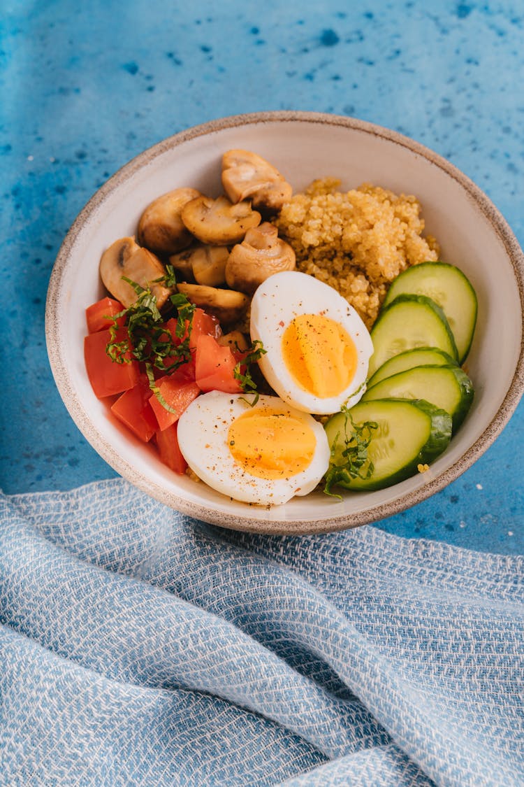 Rice Bowl With Vegetables And Boiled Egg In Close-up Shot