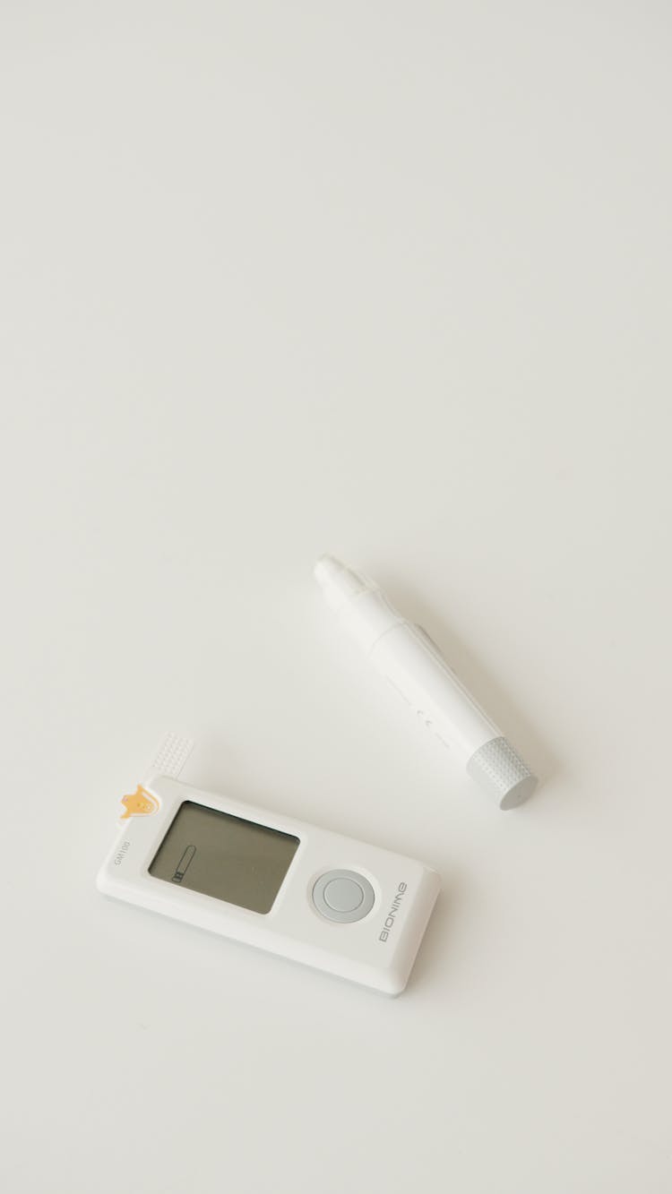 Glucose Blood Level Meter Digital Device On White Surface