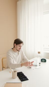 Man in White Long Sleeve Shirt Sitting on Chair