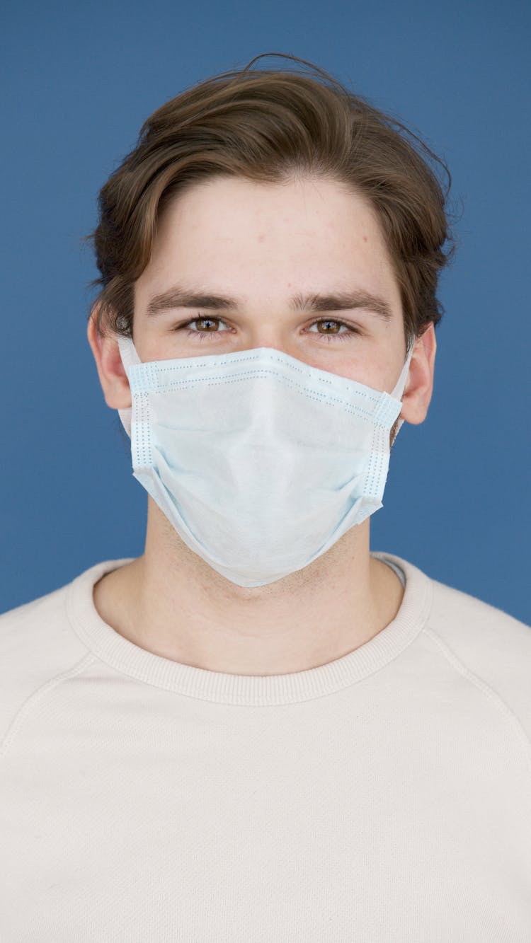 Man In White Crew Neck T-Shirt Wearing A Face Mask