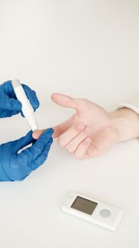 Person in Blue Gloves Holding White Tube