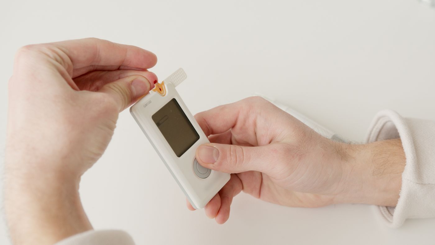 Glucose meter and notes on a desk