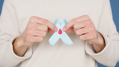 Person holding Blue Ribbon