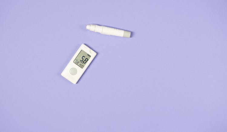 A Glucometer And A Lancet Pen