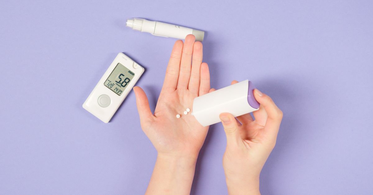 Close-up of hands using diabetes tools with a glucose monitor on a purple background. - Evidence evidence guide for magnesium blood glucose meta-analysis