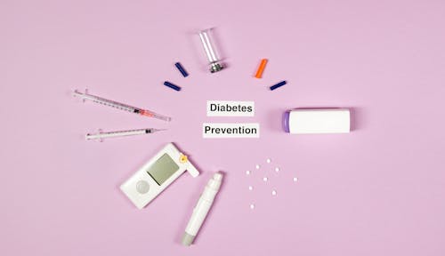 Free Diabetes Prevention Text On Pink Background With Medical Supplies Stock Photo