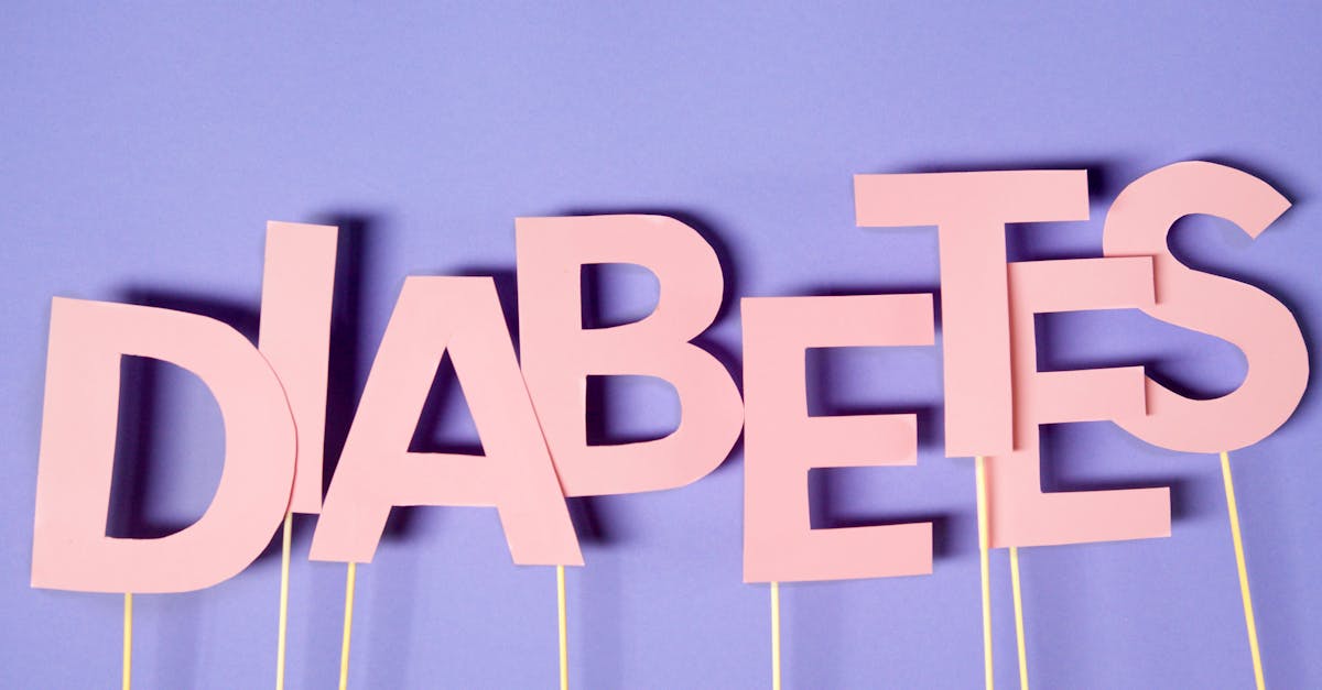 Creative conceptual image of diabetes awareness with pink letters on purple background.