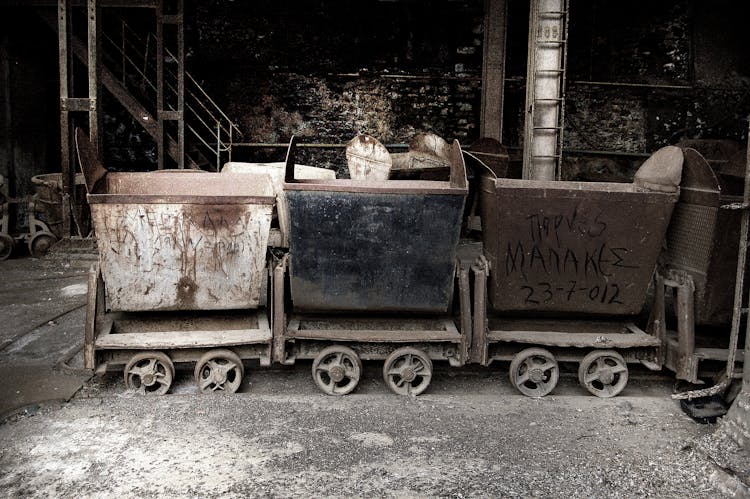 Dirty Construction Carts Parked In Garage