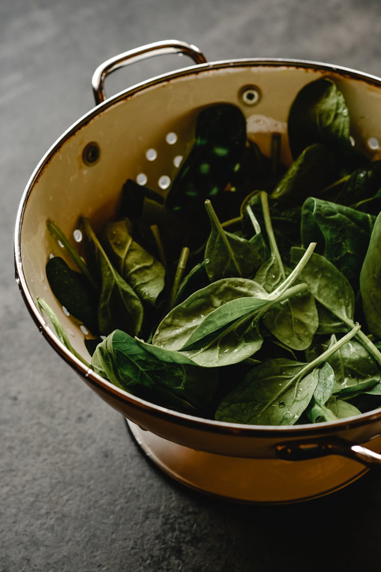 Green Spinach In The Colander