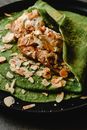 Green and Brown Leaf on Black Plate