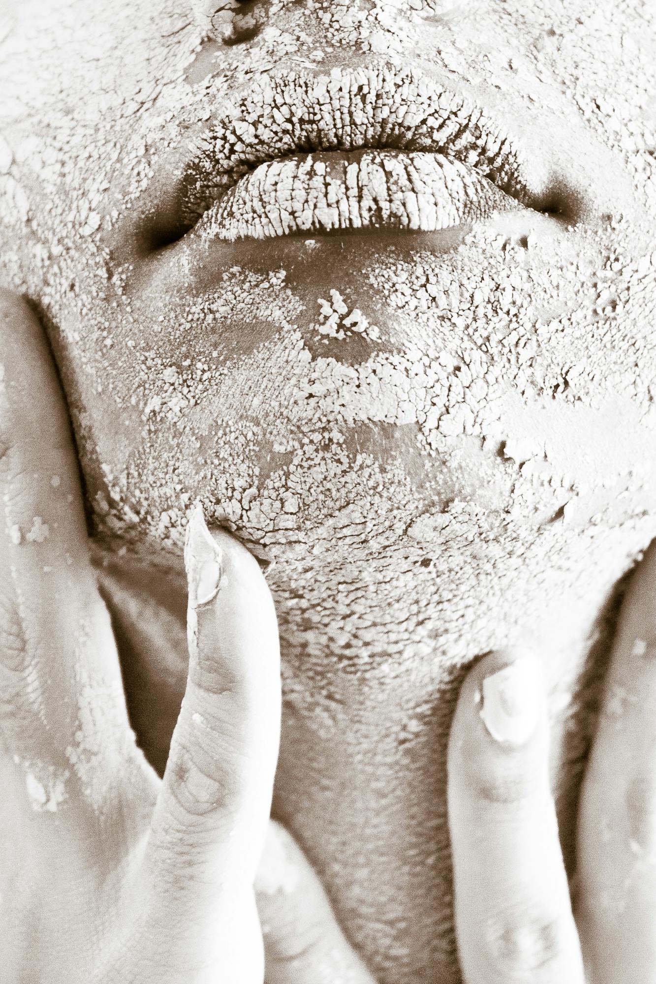 Person\'s Face Covered With White Powder