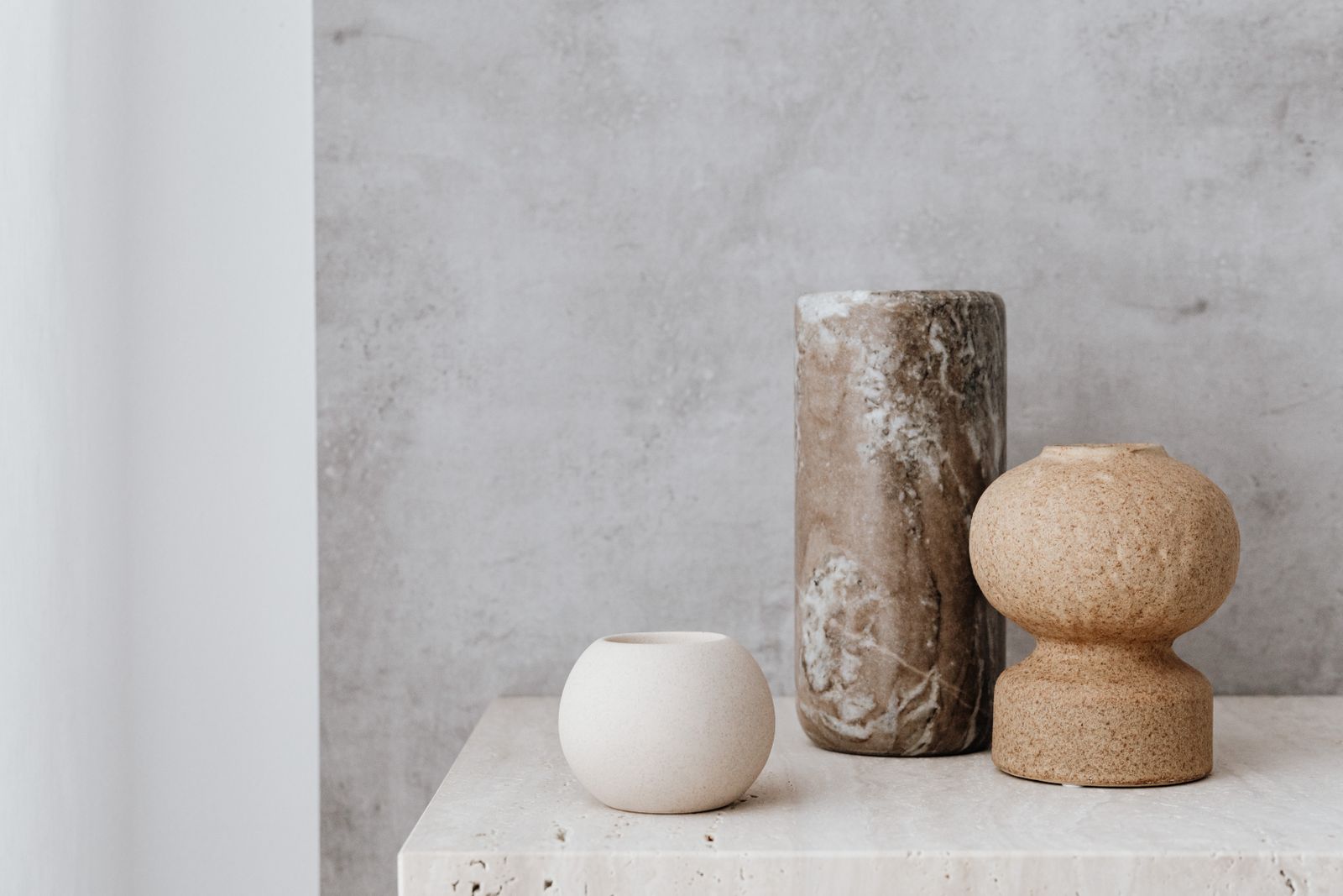 Three textured vases on a stone surface — photo by Kaboompics on Pexels