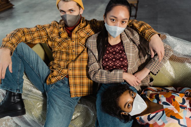 Friends Sitting On A Sofa