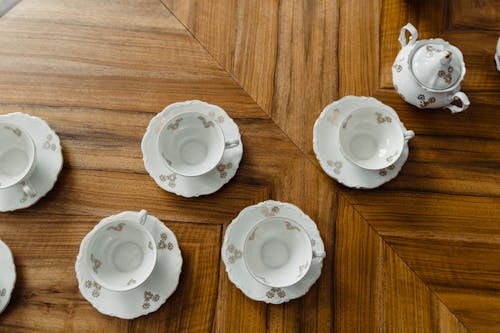 Free Close-Up Shot of White Ceramic Tea Cups on Wooden Surface Stock Photo