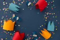 Papers Cutouts and Confetti Over Blue Surface
