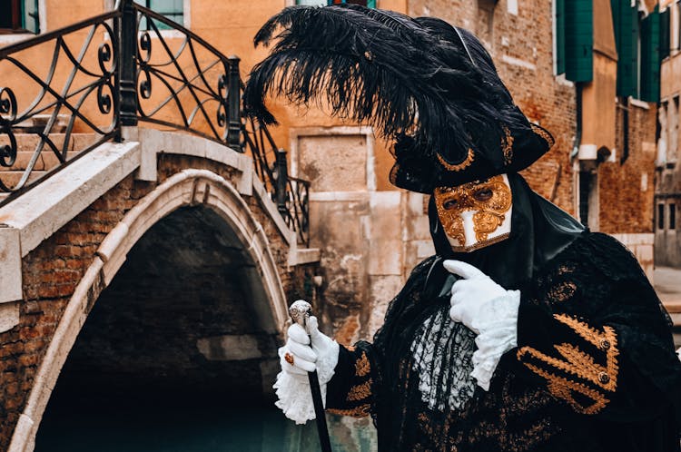 Person Wearing Mask Near The Bridge