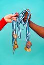 People Holding Medals