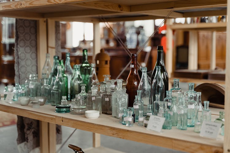 Empty Bottles Over The Wooden Shelves