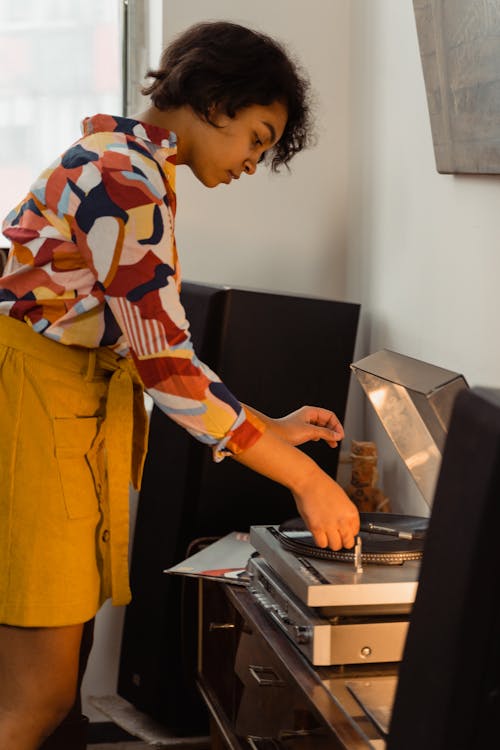 Woman Playing a Vinyl Record