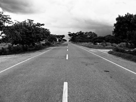 Grayscale Photography of Concrete Road during Daytime