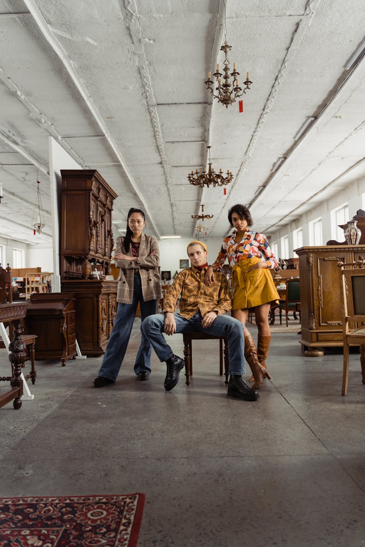 People Posing Inside A Furniture Store