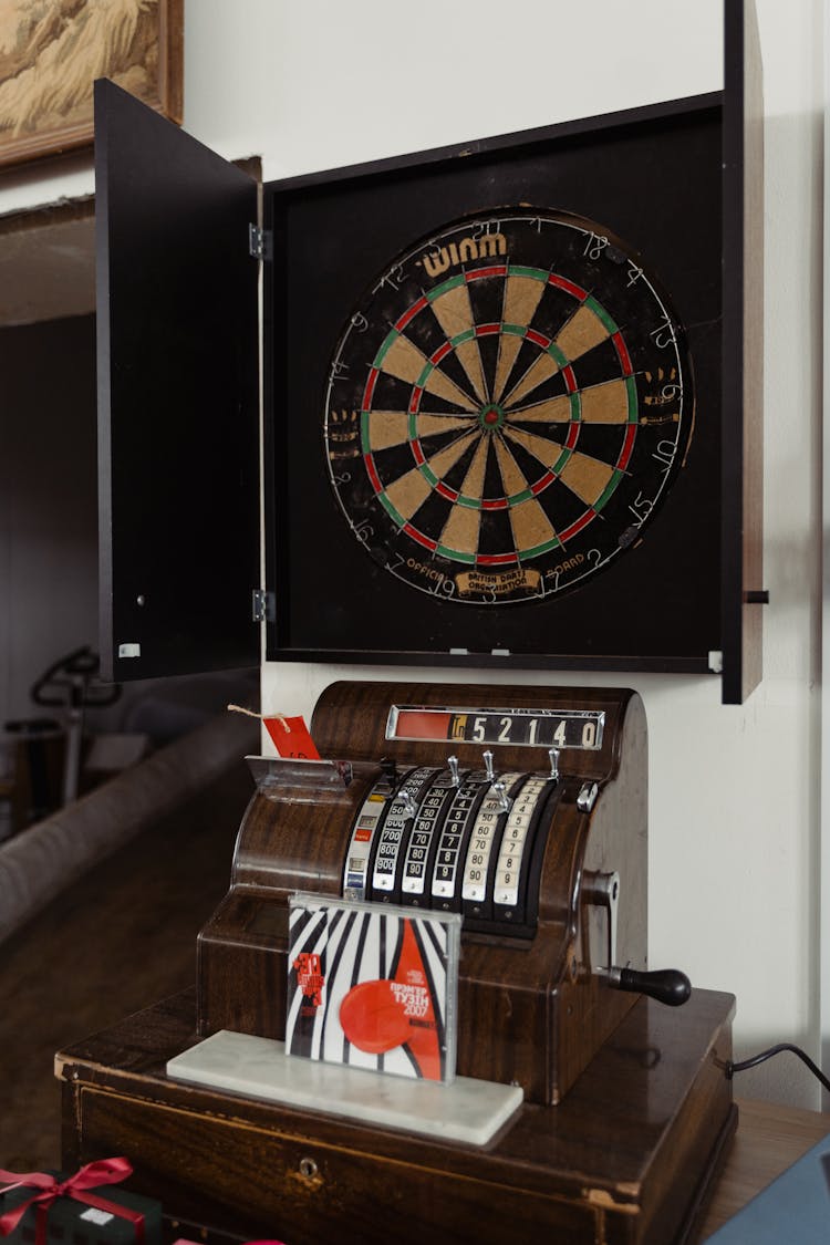 Dartboard Above Music Machine