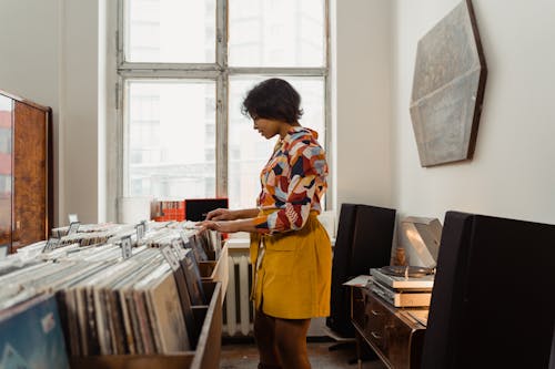 A Woman Looking at Old Vinyl Records