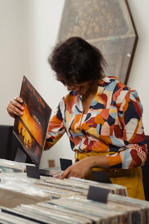 Free A Woman Shopping for Vintage Vinyl Records Stock Photo
