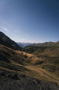 A breathtaking view of rolling hills and valleys under a clear blue sky.