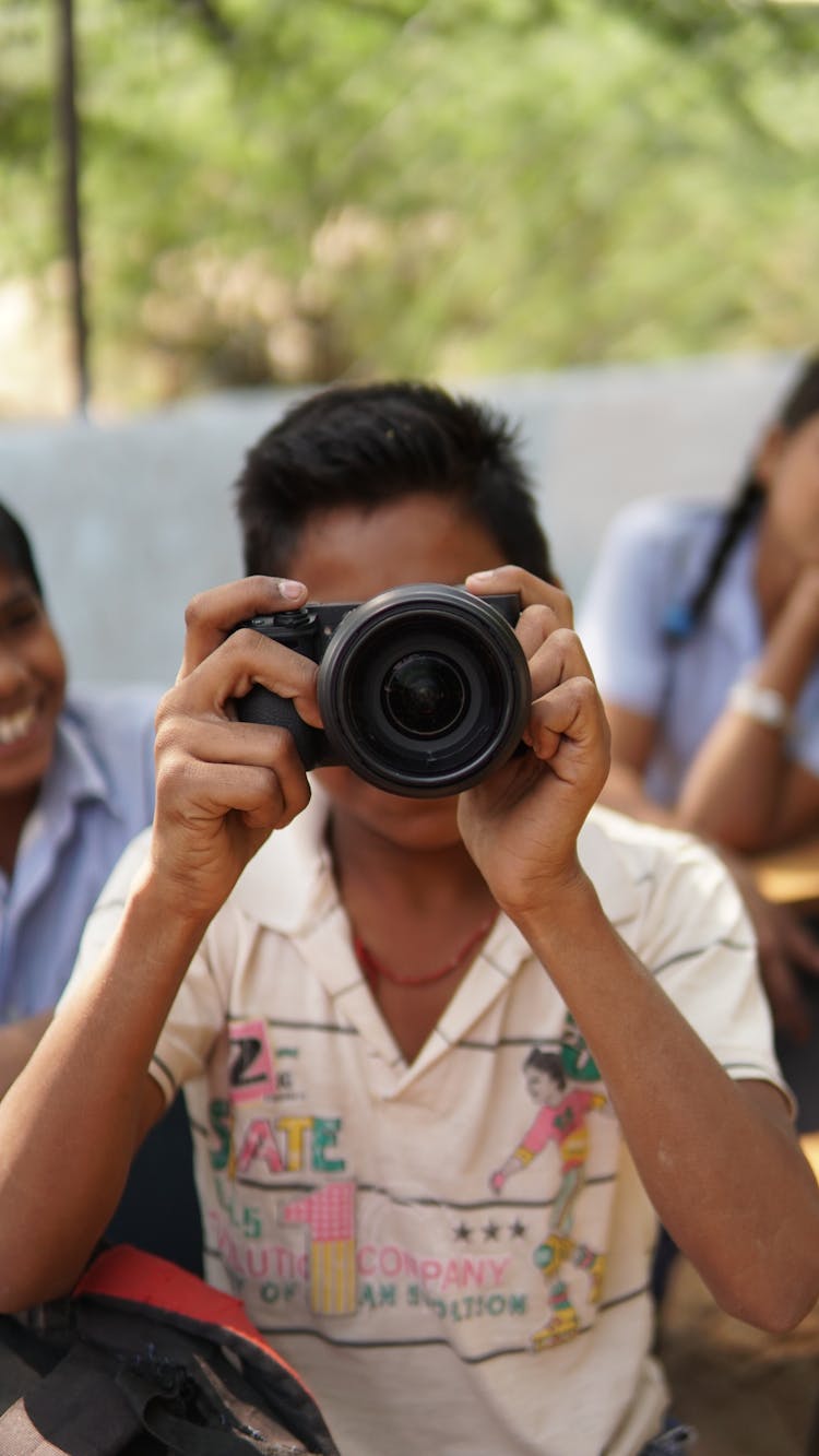 Man Taking Photograph With Camera